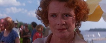 Movie still from “Dolores Claiborne” (1995), directed by Taylor Hackford – An older woman with red curly hair and blue eyes looking at the camera; Close Up shot, Low angle