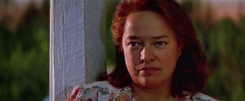 Movie still from “Dolores Claiborne” (1995), directed by Taylor Hackford – A woman's face in front of a window; Close Up shot, Over the shoulder angle