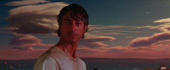 Movie still from “Dolores Claiborne” (1995), directed by Taylor Hackford – A person wearing a white t - shirt near a body of water; Close Up shot, Low angle