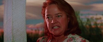 Movie still from “Dolores Claiborne” (1995), directed by Taylor Hackford – A woman's face in a floral dress; Close Up shot, Low angle