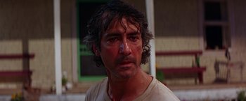 Movie still from “Dolores Claiborne” (1995), directed by Taylor Hackford – A person wearing a white t - shirt; Close Up shot, Over the shoulder angle