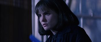 Movie still from “Dolores Claiborne” (1995), directed by Taylor Hackford – A person wearing a shirt and tie; Close Up shot, Over the shoulder angle