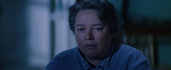 Movie still from “Dolores Claiborne” (1995), directed by Taylor Hackford – An older woman is looking at the camera; Close Up shot, Over the shoulder angle