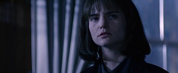 Movie still from “Dolores Claiborne” (1995), directed by Taylor Hackford – A person wearing a black shirt; Close Up shot, Over the shoulder angle