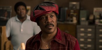 Movie still from “Dolemite Is My Name” (2019), directed by Craig Brewer – A person wearing a hat; Close Up shot, High angle