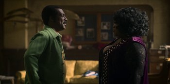 Movie still from “Dolemite Is My Name” (2019), directed by Craig Brewer – A man and a woman standing next to each other in a room; Medium shot, Over the shoulder angle