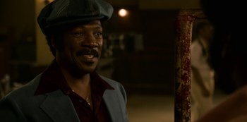 Movie still from “Dolemite Is My Name” (2019), directed by Craig Brewer – A man wearing a hat and a jacket; Close Up shot, High angle