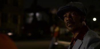 Movie still from “Dolemite Is My Name” (2019), directed by Craig Brewer – A man with a hat is standing in the dark; Close Up shot, Low angle