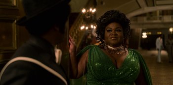 Movie still from “Dolemite Is My Name” (2019), directed by Craig Brewer – A woman in a green dress standing in front of a mirror; Close Up shot, Over the shoulder angle