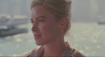 Movie still from “Double Impact” (1991), directed by Sheldon Lettich – A person wearing a jacket; Close Up shot, Over the shoulder angle