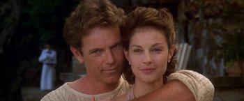 Movie still from “Double Jeopardy” (1999), directed by Bruce Beresford – A man and a woman pose for a picture; Close Up shot, Low angle