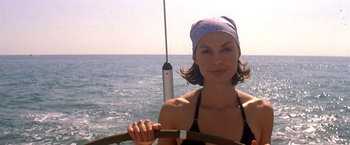 Movie still from “Double Jeopardy” (1999), directed by Bruce Beresford – A beautiful woman sitting on a boat in the water; Close Up shot, Low angle