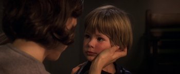 Movie still from “Double Jeopardy” (1999), directed by Bruce Beresford – A young boy is being examined by a doctor; Close Up shot, Over the shoulder angle