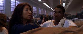 Movie still from “Double Jeopardy” (1999), directed by Bruce Beresford – A man and a woman sitting next to each other in a room; Close Up shot, Over the shoulder angle