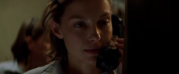 Movie still from “Double Jeopardy” (1999), directed by Bruce Beresford – A woman holding a phone up to her ear; Close Up shot, Low angle