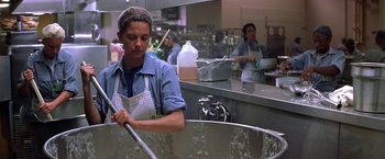 Movie still from “Double Jeopardy” (1999), directed by Bruce Beresford – A woman in a kitchen washing dishes in a sink; Medium shot, Low angle