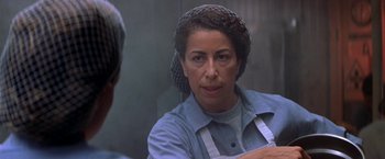 Movie still from “Double Jeopardy” (1999), directed by Bruce Beresford – An older woman in a blue shirt looking in a mirror; Close Up shot, Over the shoulder angle