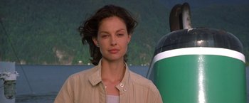 Movie still from “Double Jeopardy” (1999), directed by Bruce Beresford – A woman standing in front of an airplane; Close Up shot, Low angle