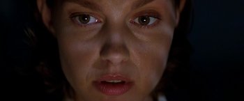 Movie still from “Double Jeopardy” (1999), directed by Bruce Beresford – A woman's face with tears coming out of her eyes; Extreme Close Up shot, Overhead angle