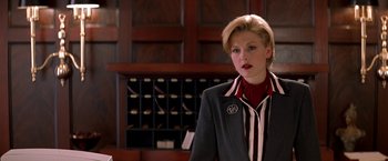 Movie still from “Double Jeopardy” (1999), directed by Bruce Beresford – A woman standing in front of a wall of drawers; Medium shot, Over the shoulder angle