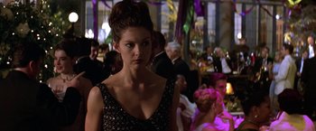 Movie still from “Double Jeopardy” (1999), directed by Bruce Beresford – A woman standing in front of a group of people; Close Up shot, Over the shoulder angle