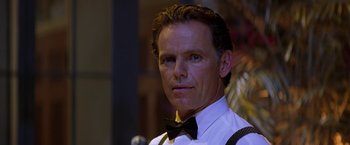 Movie still from “Double Jeopardy” (1999), directed by Bruce Beresford – A person wearing a bow tie and suspenders; Close Up shot, Low angle