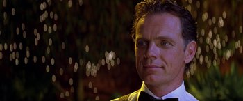 Movie still from “Double Jeopardy” (1999), directed by Bruce Beresford – A person wearing a tuxedo; Close Up shot, Over the shoulder angle