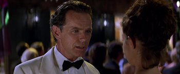 Movie still from “Double Jeopardy” (1999), directed by Bruce Beresford – A person wearing a bow tie; Close Up shot, Over the shoulder angle