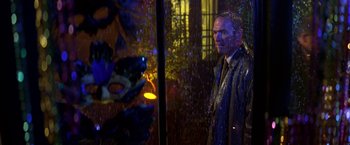 Movie still from “Double Jeopardy” (1999), directed by Bruce Beresford – A man standing in front of a window in the rain; Medium shot, Over the shoulder angle