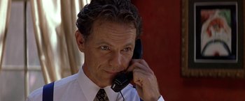 Movie still from “Double Jeopardy” (1999), directed by Bruce Beresford – A person talking on a phone; Close Up shot, Low angle