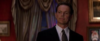 Movie still from “Double Jeopardy” (1999), directed by Bruce Beresford – A person wearing a suit and tie; Close Up shot, Low angle