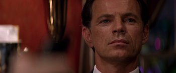 Movie still from “Double Jeopardy” (1999), directed by Bruce Beresford – A person wearing a suit and tie; Close Up shot, Low angle