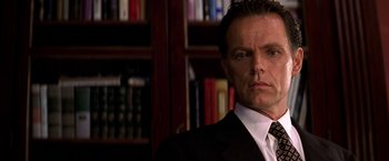 Movie still from “Double Jeopardy” (1999), directed by Bruce Beresford – A person wearing a suit and tie; Close Up shot, Low angle