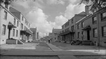 Movie still from “Down by Law” (1986), directed by Jim Jarmusch – An old black and white photo of an empty street; Extreme Wide shot, High angle