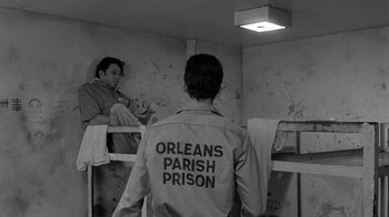 Movie still from “Down by Law” (1986), directed by Jim Jarmusch – Two men standing in a jail cell; Wide shot, Over the shoulder angle