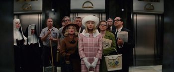 Movie still from “Down with Love” (2003), directed by Peyton Reed – A group of people standing in front of each other; Medium shot, Low angle