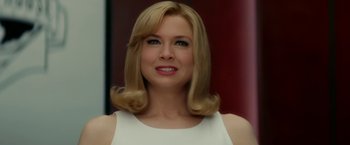 Movie still from “Down with Love” (2003), directed by Peyton Reed – A woman with blonde hair wearing a white dress; Close Up shot, Low angle