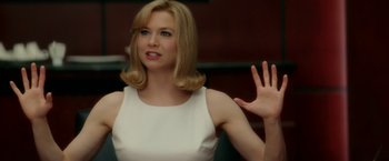 Movie still from “Down with Love” (2003), directed by Peyton Reed – A woman in a white dress waves at the camera; Close Up shot, Over the shoulder angle