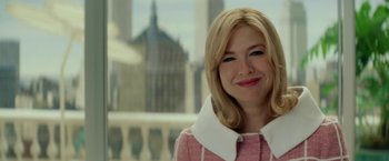 Movie still from “Down with Love” (2003), directed by Peyton Reed – A woman with blonde hair wearing a pink jacket; Close Up shot, Over the shoulder angle