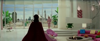 Movie still from “Down with Love” (2003), directed by Peyton Reed – A woman standing in front of a window in a living room; Wide shot, Low angle
