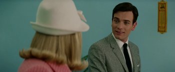 Movie still from “Down with Love” (2003), directed by Peyton Reed – A man in a white hat and a woman in a checkered suit; Close Up shot, Over the shoulder angle