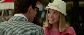 Movie still from “Down with Love” (2003), directed by Peyton Reed – A man and a woman smiling for the camera; Close Up shot, Over the shoulder angle