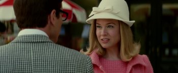 Movie still from “Down with Love” (2003), directed by Peyton Reed – A woman wearing a white hat talking to a man; Close Up shot, Over the shoulder angle