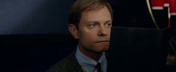 Movie still from “Down with Love” (2003), directed by Peyton Reed – A person wearing a suit and tie; Close Up shot, High angle