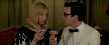 Movie still from “Down with Love” (2003), directed by Peyton Reed – A man and a woman are holding wine glasses; Close Up shot, Over the shoulder angle