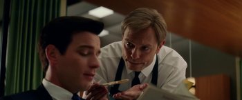 Movie still from “Down with Love” (2003), directed by Peyton Reed – A man in a white shirt and a man in a black tie; Close Up shot, Over the shoulder angle