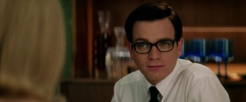 Movie still from “Down with Love” (2003), directed by Peyton Reed – A man in a white dress shirt and black tie; Close Up shot, Over the shoulder angle