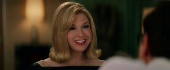 Movie still from “Down with Love” (2003), directed by Peyton Reed – A person with blonde hair; Close Up shot, Over the shoulder angle
