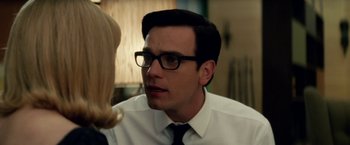 Movie still from “Down with Love” (2003), directed by Peyton Reed – A man wearing a white shirt and black tie; Close Up shot, Over the shoulder angle