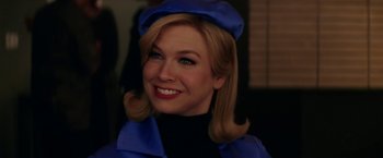 Movie still from “Down with Love” (2003), directed by Peyton Reed – A person wearing a hat; Close Up shot, Low angle